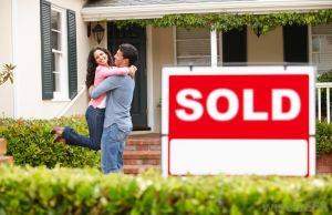 First Time Homeowner Insurance - Couple In Front Of House